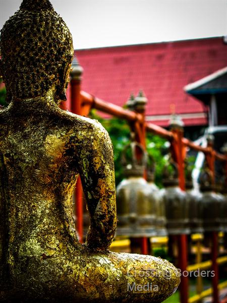 Sitting-At-A-Buddhist-Temple by Crossing Borders Media